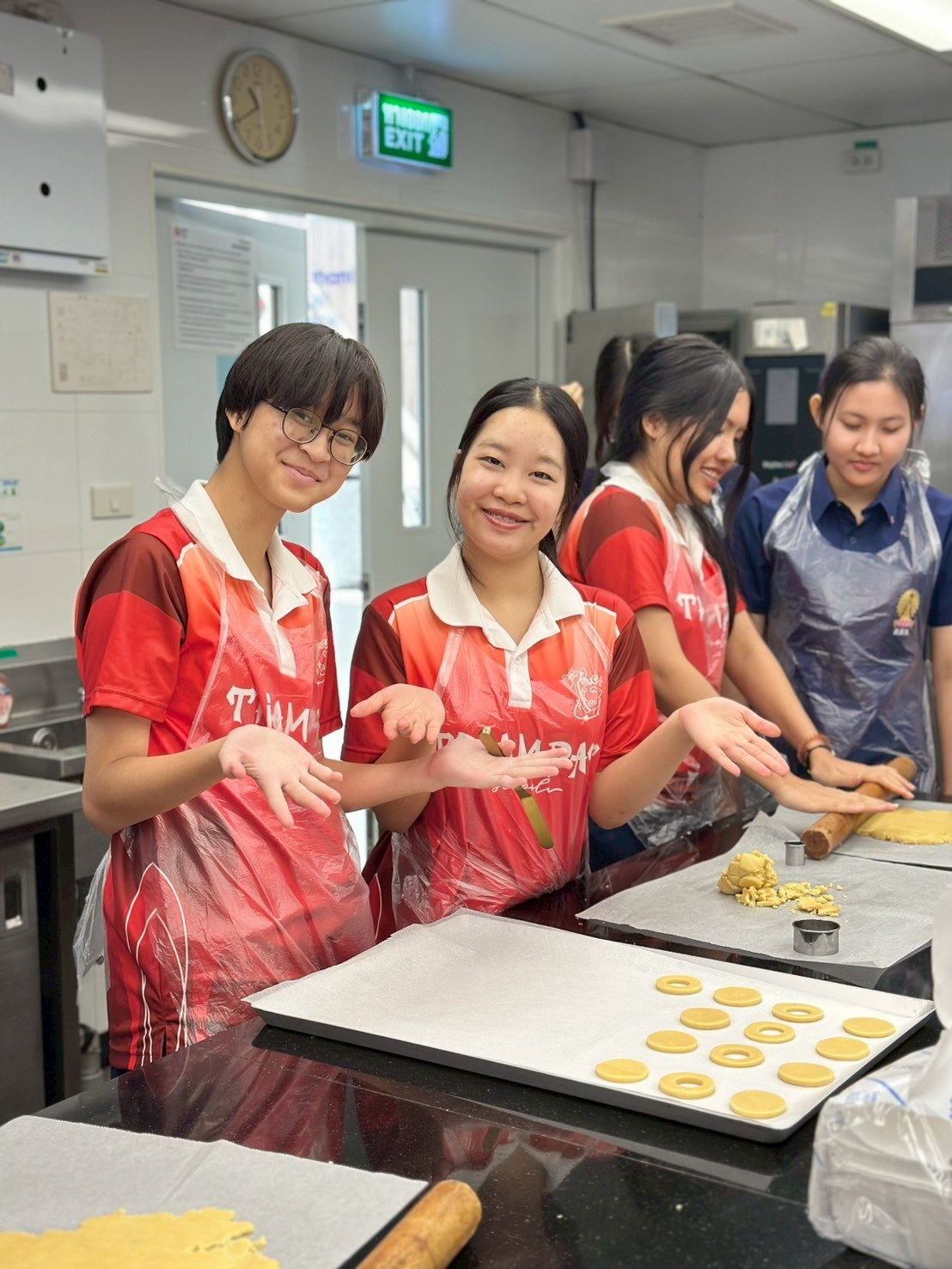 Students practising baking techniques