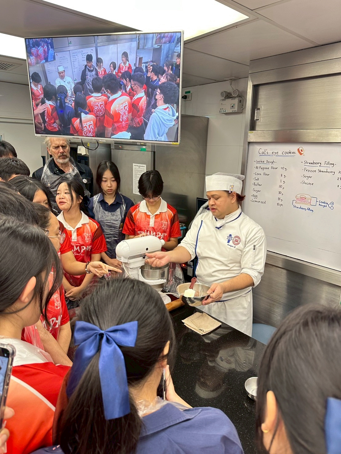 Students learning baking techniques